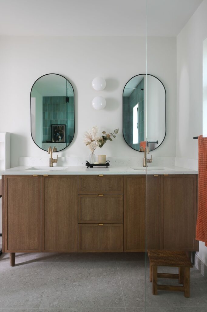 Bathroom fixtures with mixed metals in gold-black and silver-black combinations.