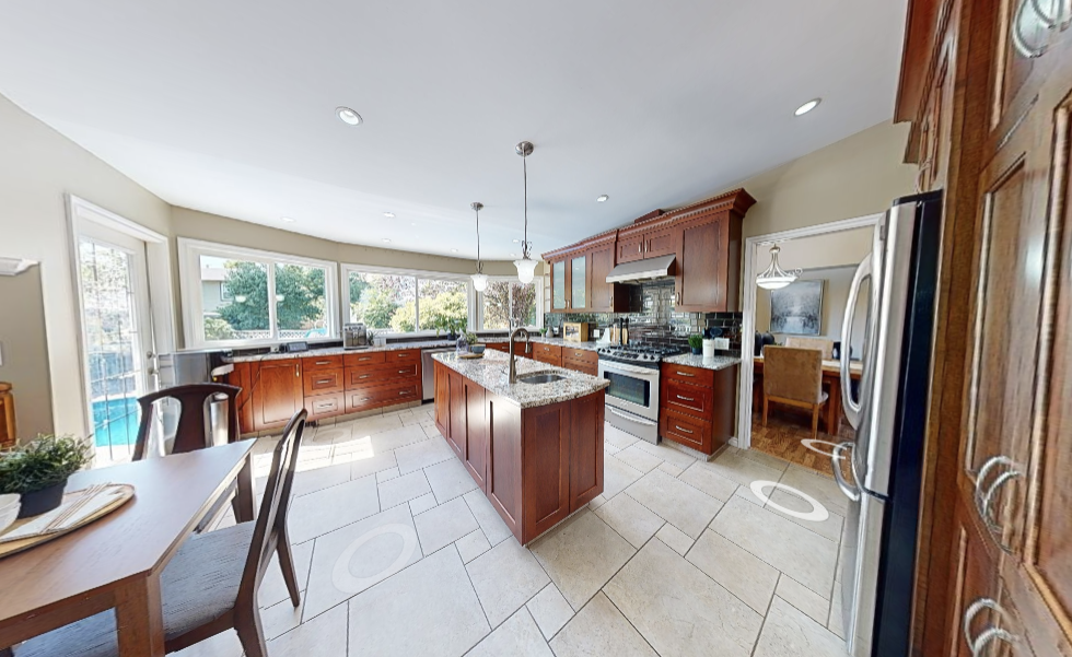 Before image of Surrey Springs kitchen with outdated fixtures.