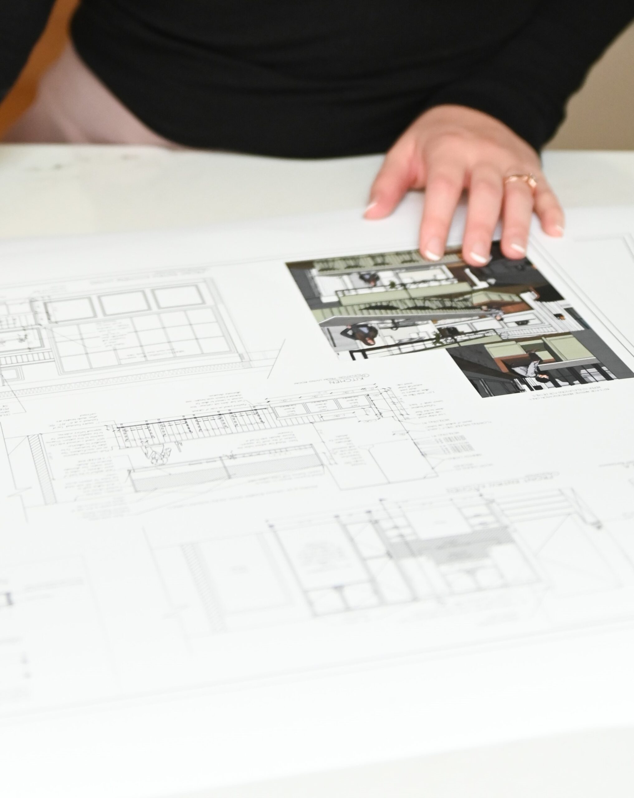 reviewing home plan drawings in meeting  - Align Interior Design - Designer Rebecca Foster