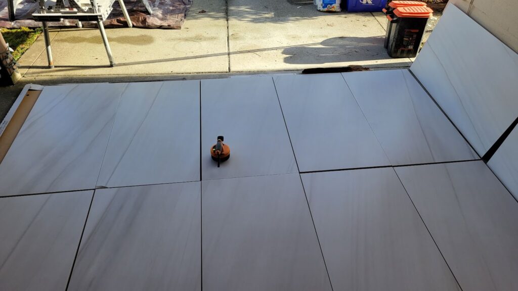 large bathroom tiles laid out on the ground