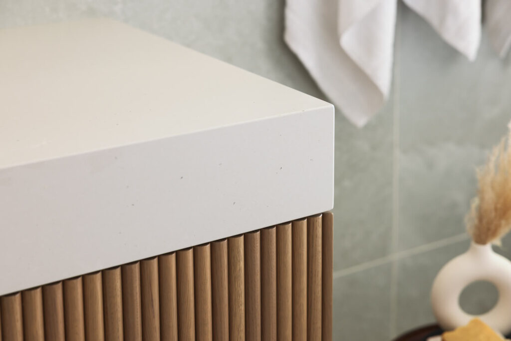 Custom bathroom vanity with fluted wood detail designed by Align Interior Design in Coquitlam BC