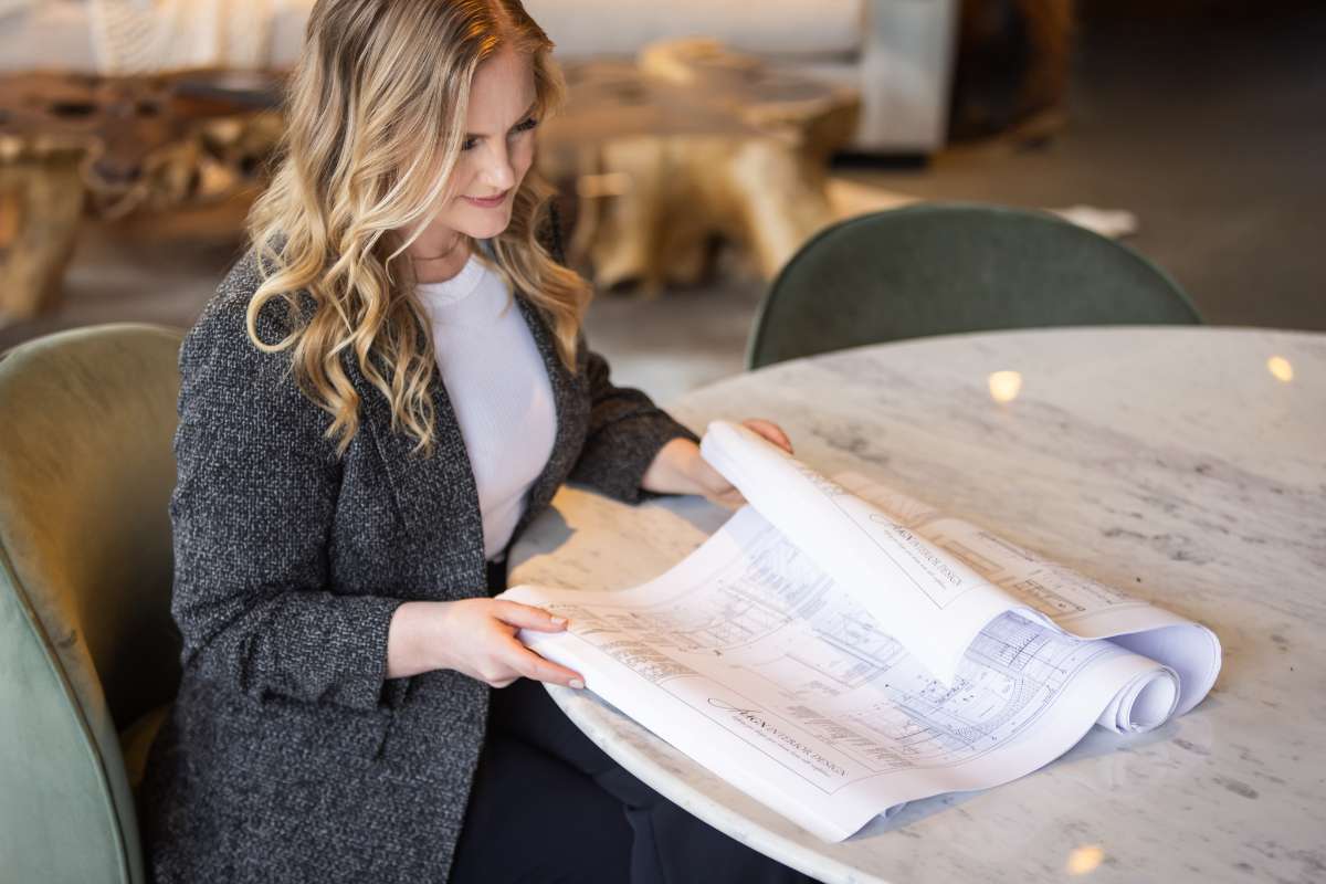 Interior designer reviewing renovation plans for a thoughtfully designed home